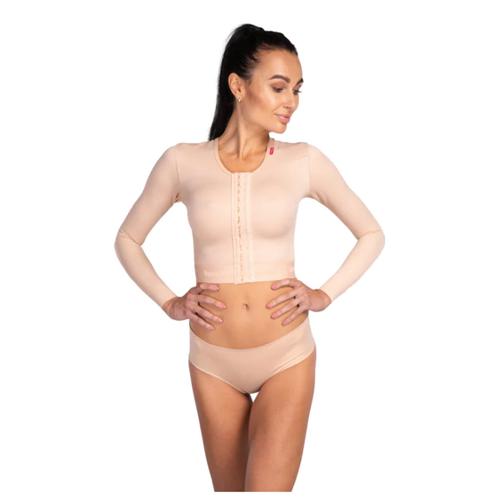 Woman wearing Lipoelastic MT Smooth Variant beige compression vest with long sleeves for post-op arm liposuction recovery